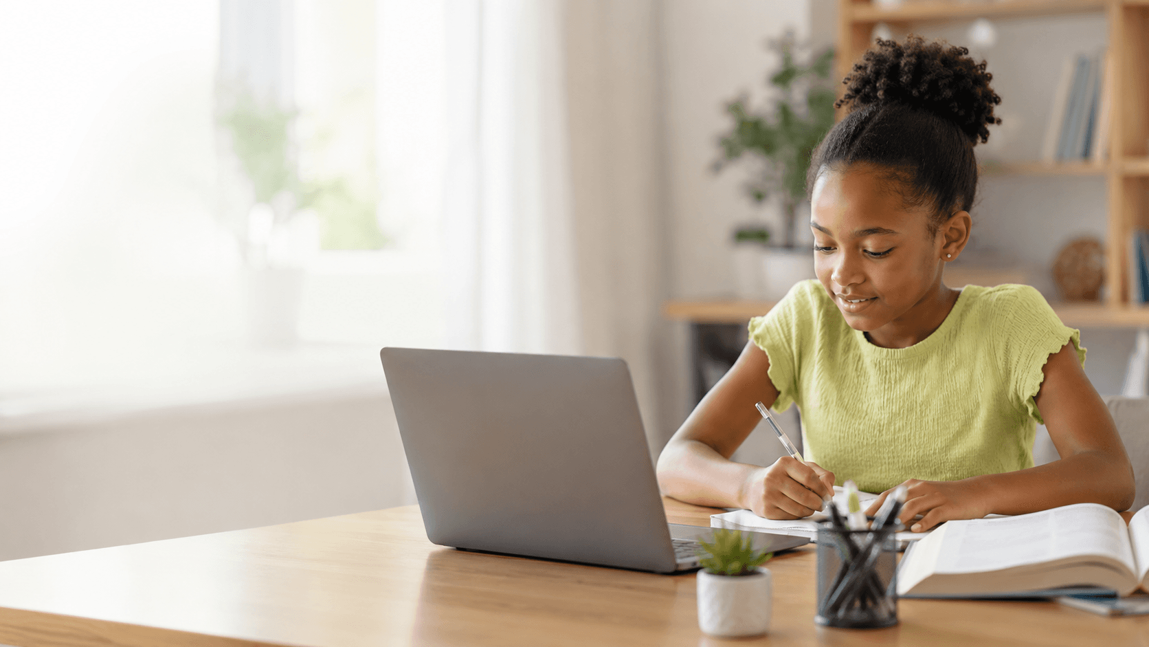 Student learning at home with books and digital study support